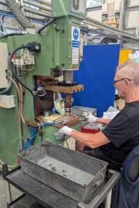 Paul making fasteners on one of the older machines