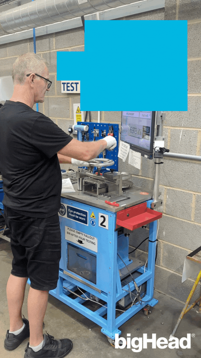 Paul using the tensile testing machine