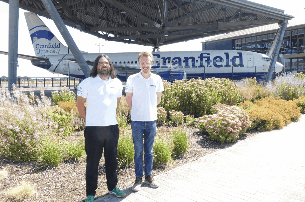 Lawrence Cook and Oli Le Marquand-Brown standing outside Cranfield University, with a plane in the background